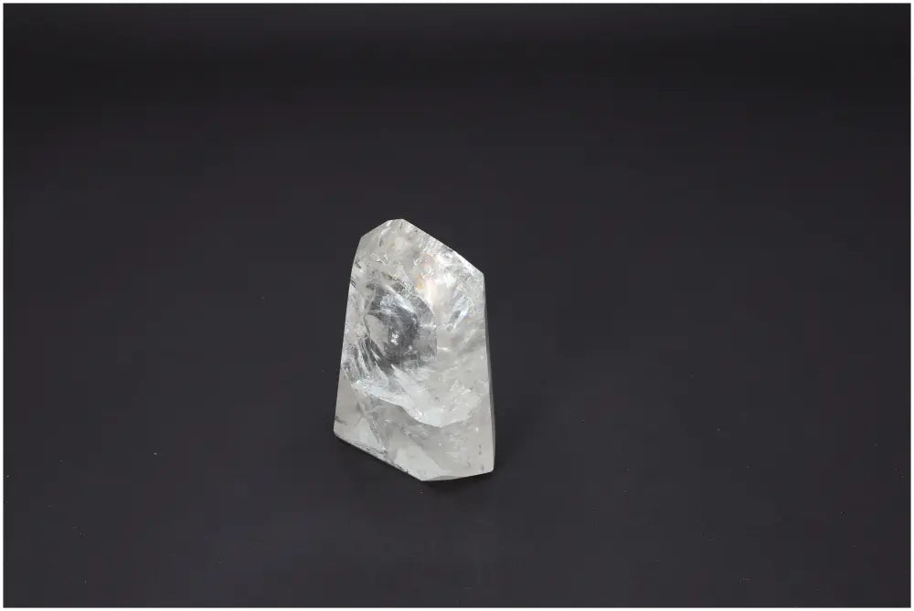 Lemurian Quartz Obelisk on dark background showcasing its unique energetic and spiritual properties.