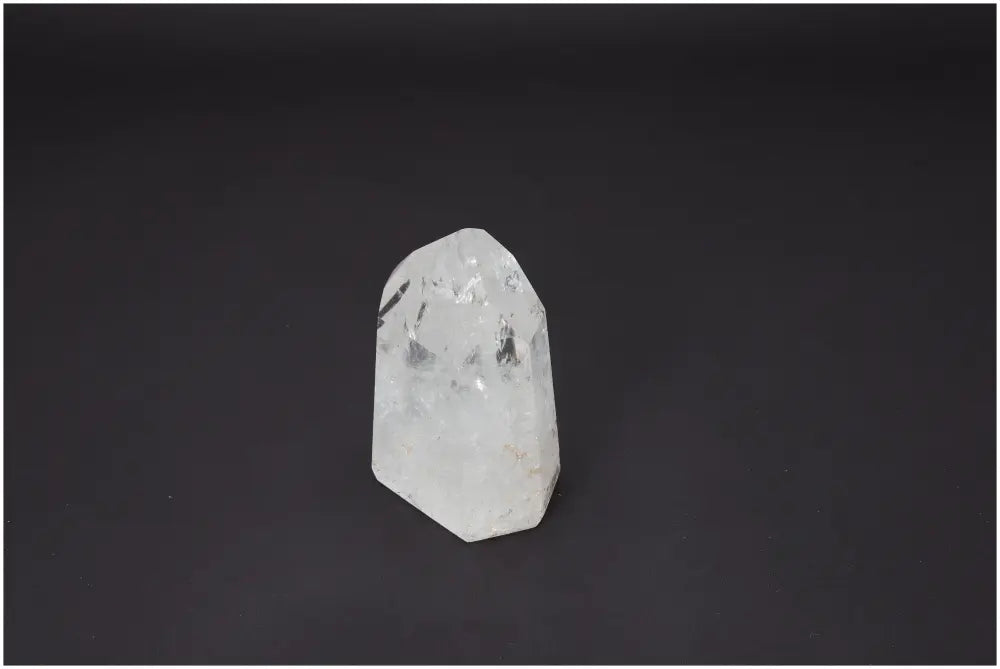 Lemurian Quartz Obelisk on black background, enhancing spiritual needs with unique chakra and zodiac properties.