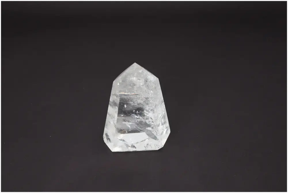 Lemurian Quartz Obelisk on black background, showcasing its clarity and unique energetic properties for chakra alignment.