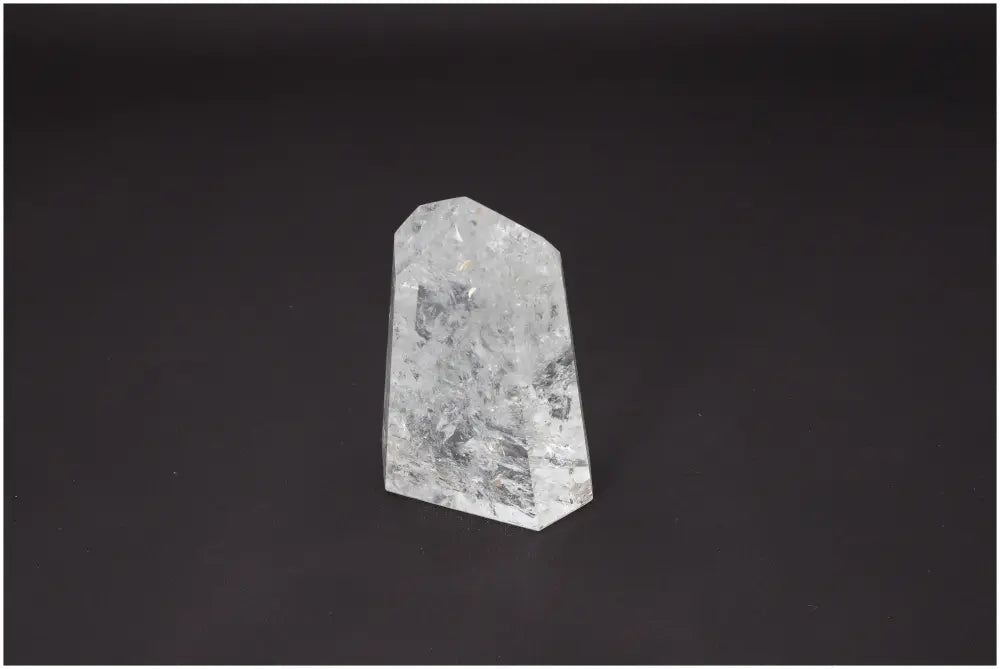 Lemurian Quartz Obelisk on a dark background symbolizing spiritual and energetic properties associated with chakras and zodiac signs.