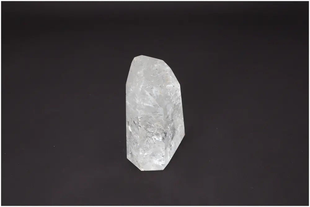 Lemurian Quartz Obelisk with unique energetic properties and chakra associations on a dark background.