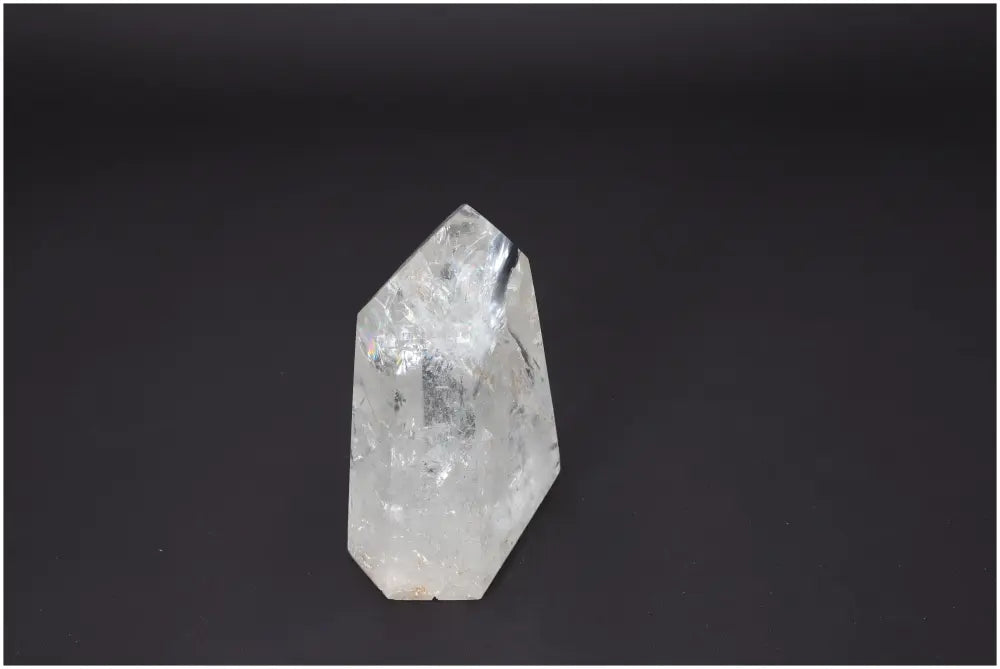 Lemurian Quartz Obelisk with unique energetic properties on a dark background, ideal for spiritual and chakra healing.