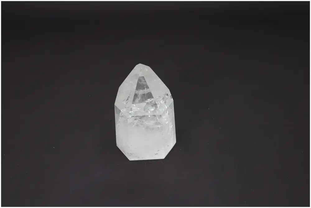 Lemurian Quartz Obelisk on black background, highlighting its unique spiritual energy and chakra alignment properties.