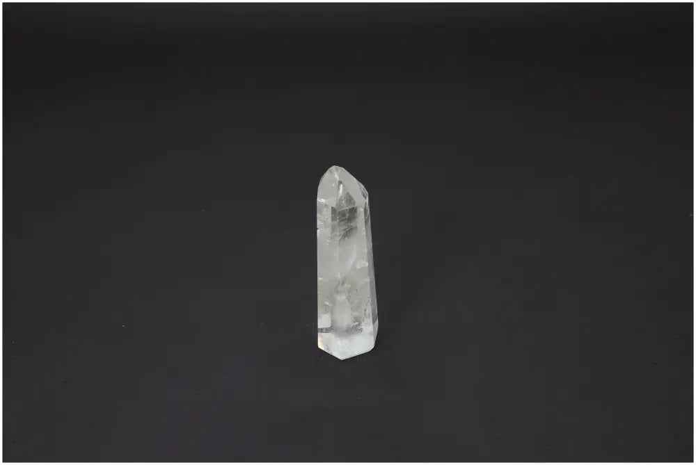 Lemurian Quartz Obelisk against black background, ideal for chakra alignment and zodiac energy balance, enhancing spiritual wellness.