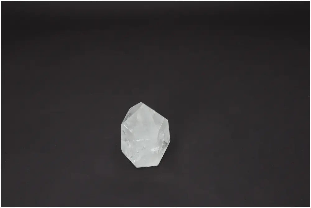 Lemurian Quartz Obelisk on dark background, enhancing chakras and zodiac energies.