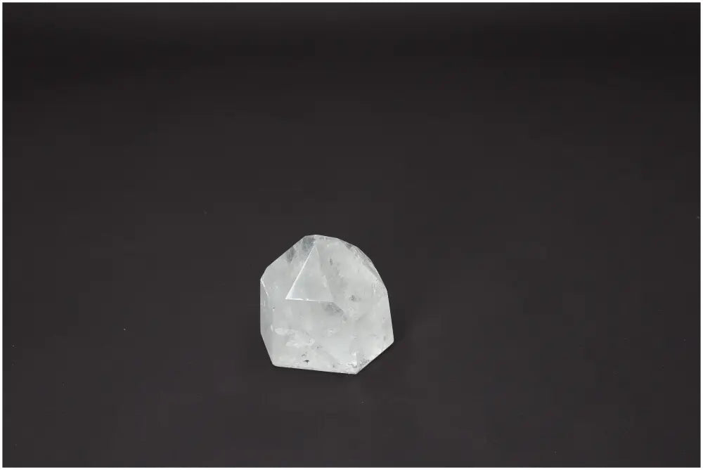 Lemurian Quartz Obelisk on dark background, showcasing unique properties for energetic and spiritual healing, linked to chakras and zodiac signs.