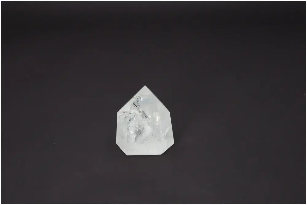 Lemurian Quartz Obelisk crystal on a dark background, showcasing its unique properties for chakra and zodiac energy alignment.