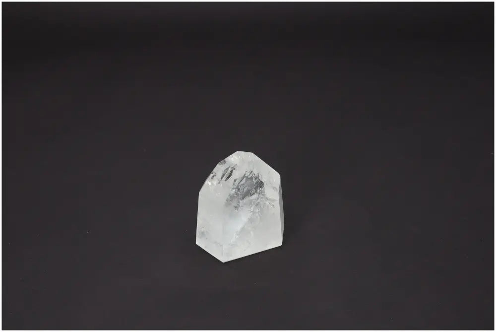 Lemurian Quartz Obelisk on black background, known for its spiritual and energetic properties, connects chakras and supports zodiac signs.