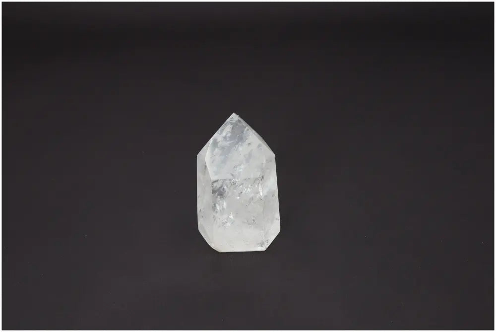 Lemurian Quartz Obelisk for chakra alignment and spiritual energy work against a black background.