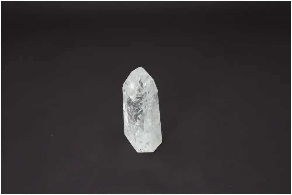 Lemurian Quartz Obelisk on black background, enhancing energetic and spiritual needs through unique properties and characteristics.