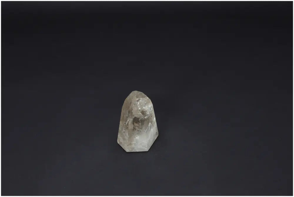 Lemurian quartz obelisk against a dark background, showcasing unique spiritual and energetic properties linked to chakras and zodiac signs.