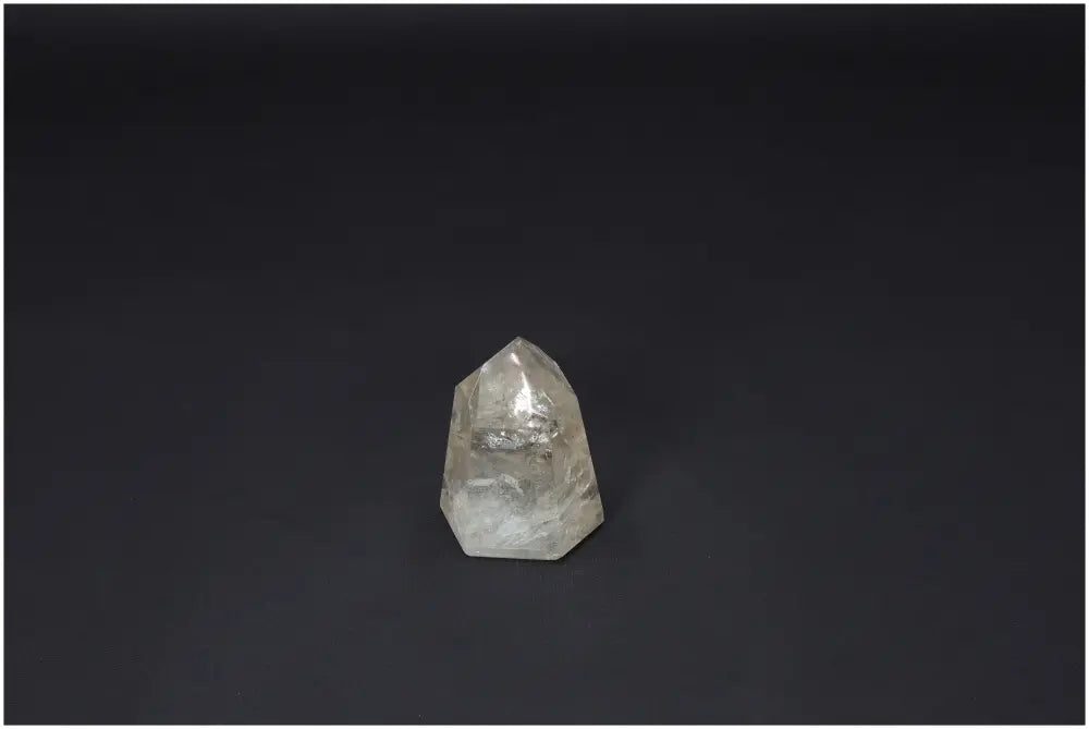 Lemurian Quartz Obelisk on black background, ideal for chakra healing, spiritual energy, and zodiac sign alignment.