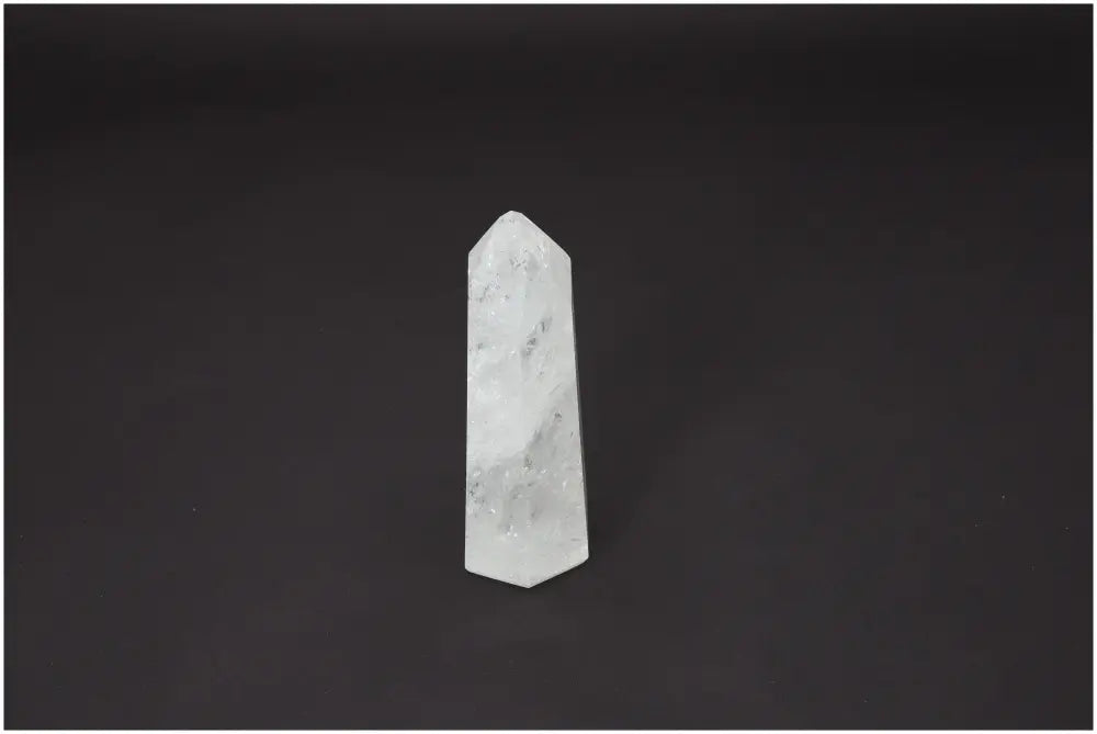 Lemurian Quartz Obelisk on black background, showcasing its unique properties and supporting spiritual and energetic needs.
