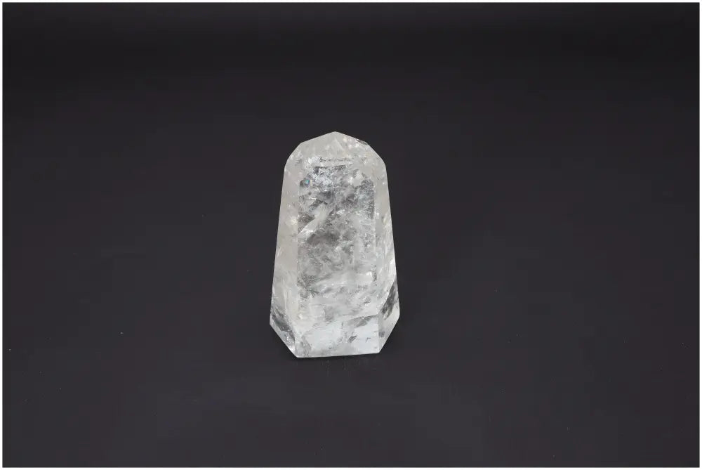 Lemurian Quartz Obelisk against dark background, showcasing clarity and spiritual energy benefits for chakra and zodiac healing.