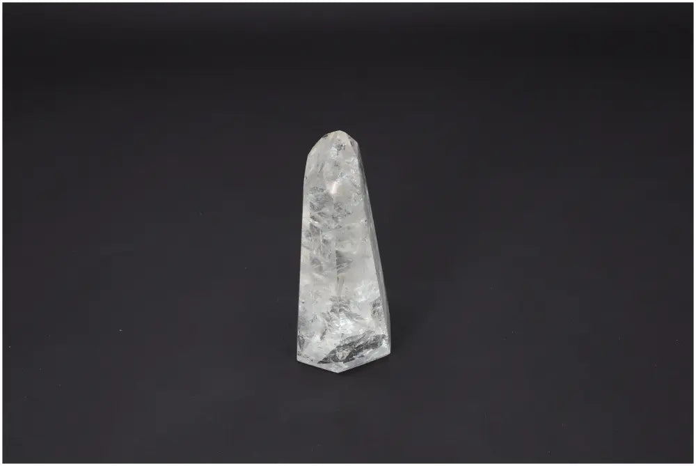 Lemurian Quartz Obelisk with unique energetic properties on a dark background.