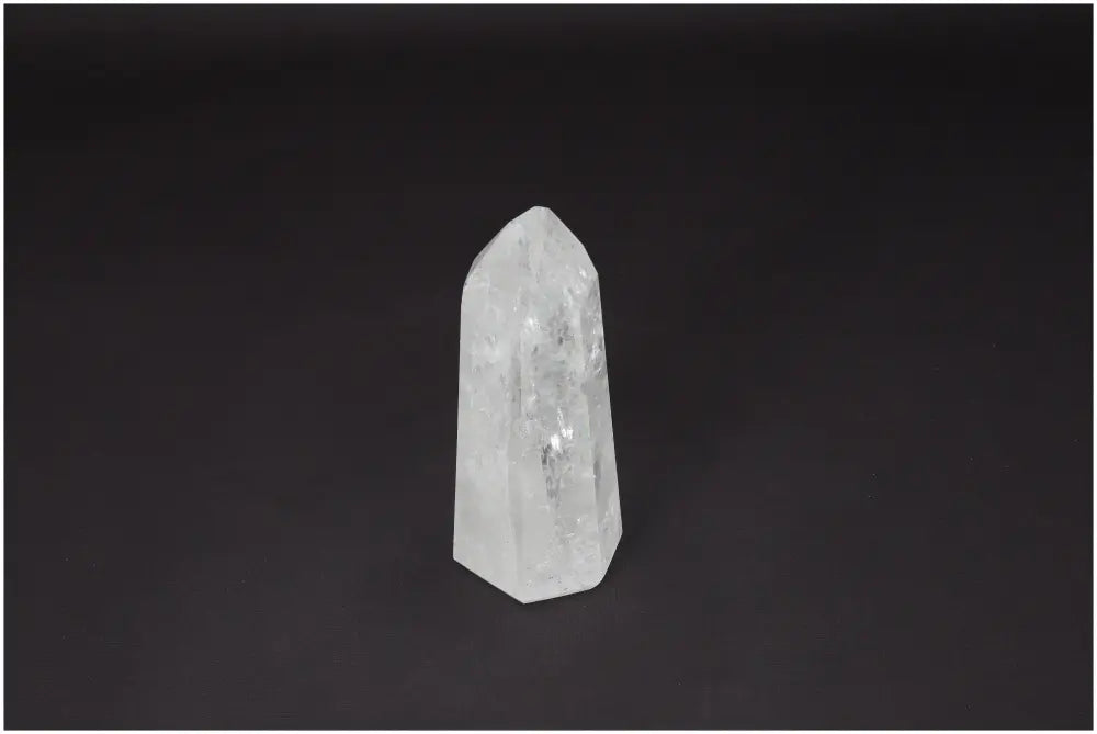 Lemurian Quartz Obelisk against dark background, known as "Master Healer", promotes clarity, balance, and personal growth.