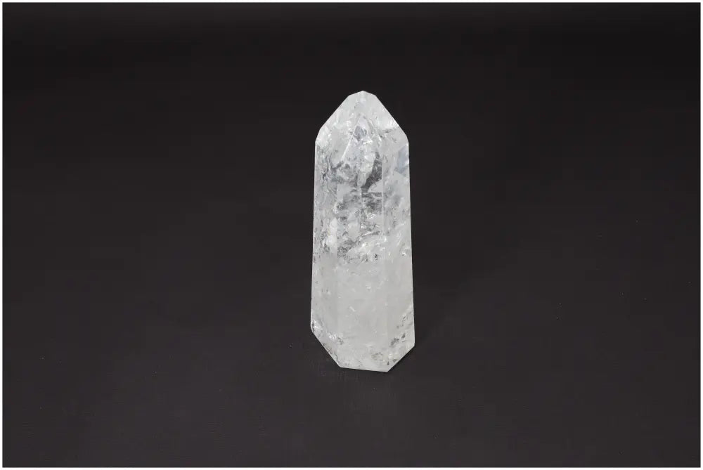 Lemurian Quartz Obelisk on black background showcasing its clarity and natural form, ideal for energy amplification and personal growth.