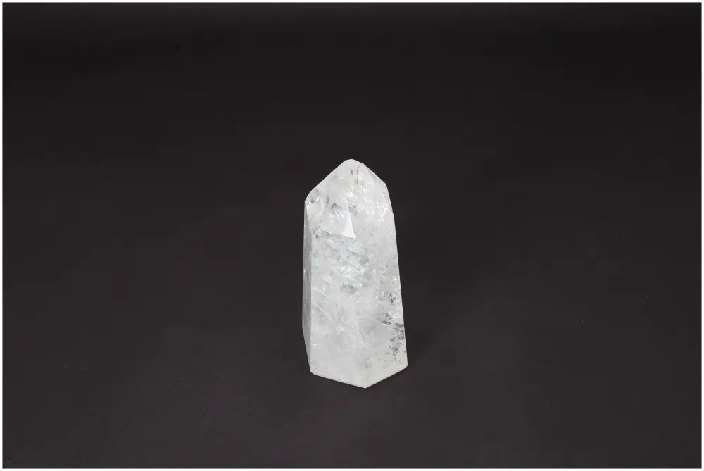 Lemurian Quartz Obelisk crystal on black background, known as Master Healer, enhances clarity and balance, ethically sourced and hand-selected.