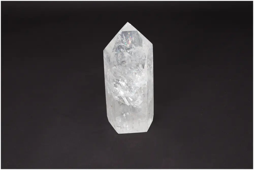 Lemurian Quartz Obelisk on black background, showcasing its natural clarity and healing properties.