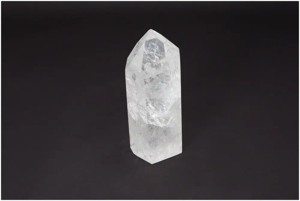 Lemurian Quartz Obelisk on black background, showcasing its crystal clarity and natural formation. Ideal for energy amplification.