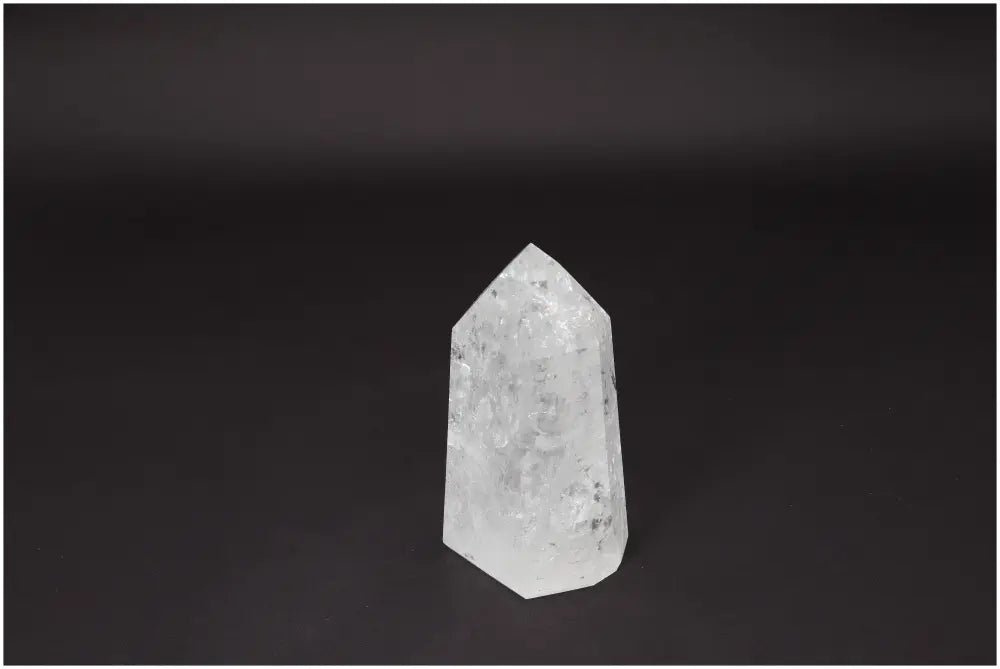 Lemurian Quartz Obelisk on dark background, a powerful crystal for clarity, balance, and personal growth