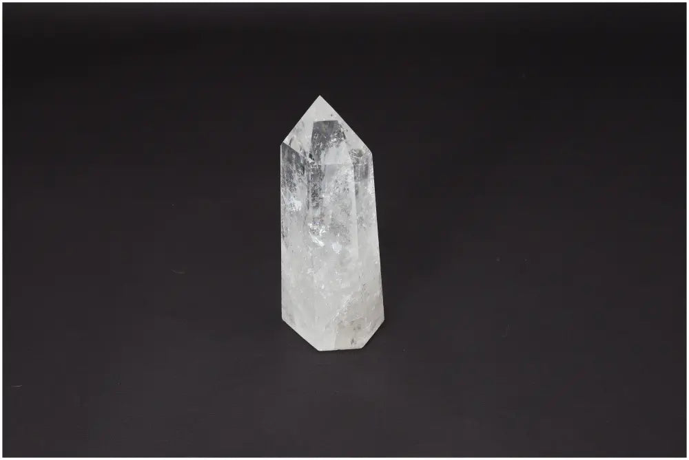 Lemurian Quartz Obelisk on black background, known as Master Healer, amplifies clarity and energy, ethically sourced and hand-selected.