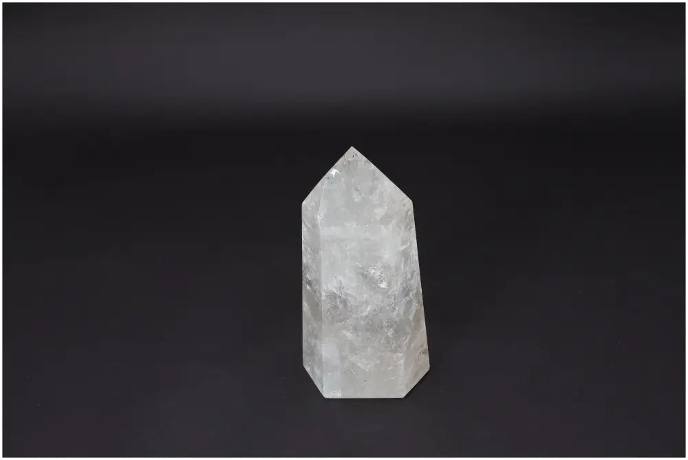 Lemurian Quartz Obelisk for clarity and healing on a dark background, ethically sourced and naturally formed.