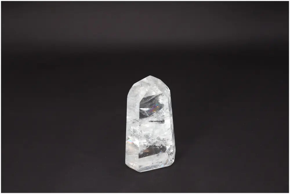 Lemurian Quartz Obelisk crystal on a dark background, known for clarity and healing, hand-selected and ethically sourced.
