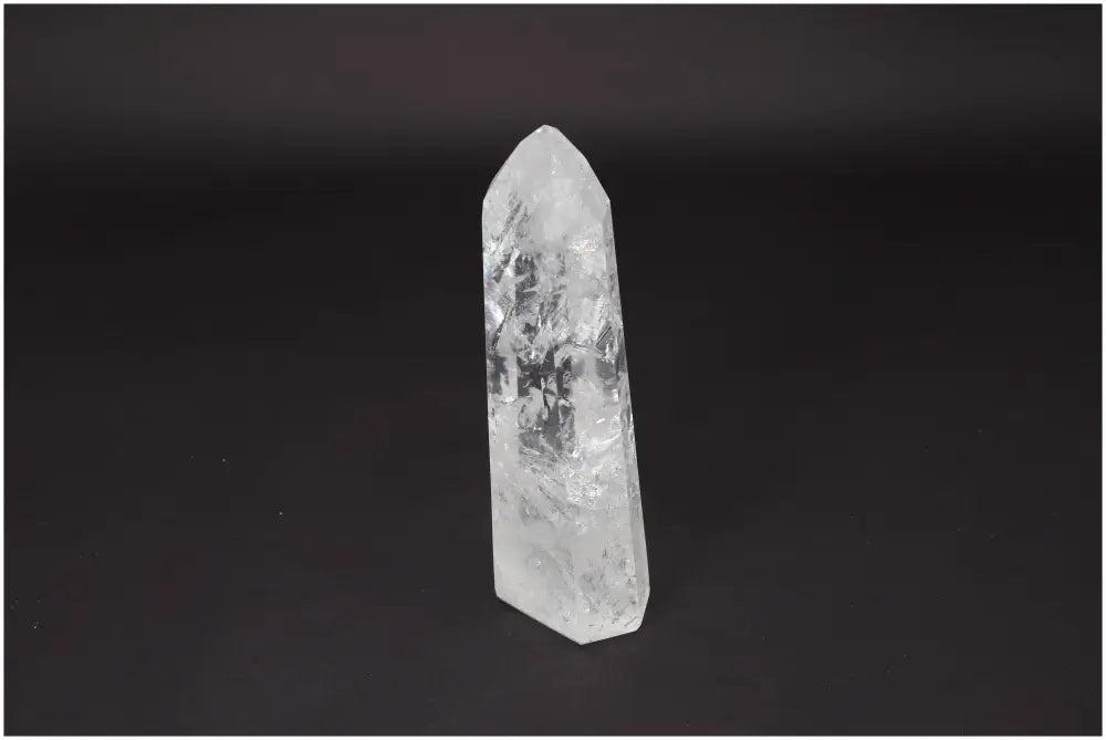 Lemurian Quartz Obelisk on black background, ideal for clarity, balance, and spiritual growth; hand-selected and ethically sourced crystal.