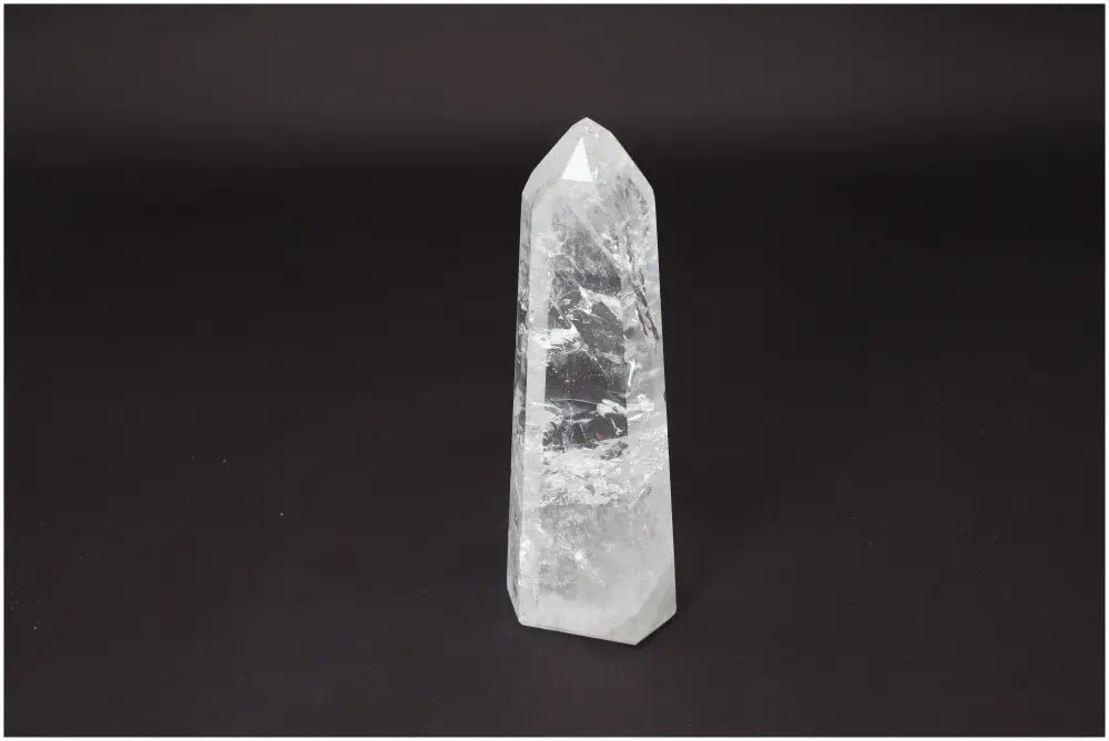 Lemurian Quartz Obelisk Master Healer crystal for clarity and balance on a dark background; ethically sourced and naturally formed.