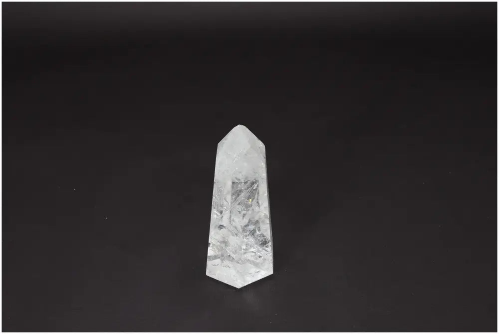 Lemurian Quartz Obelisk on a dark background, showcasing its clear and natural formation, ideal for clarity and personal growth.