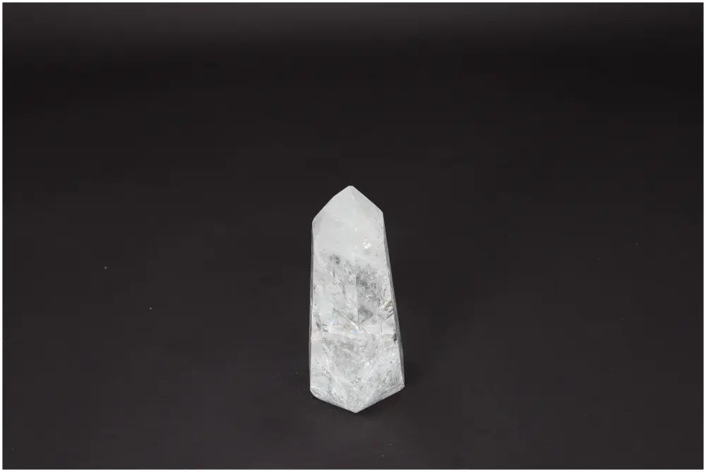 Lemurian Quartz Obelisk on a dark background, symbolizing clarity and personal growth. Ethically sourced and naturally formed crystal.