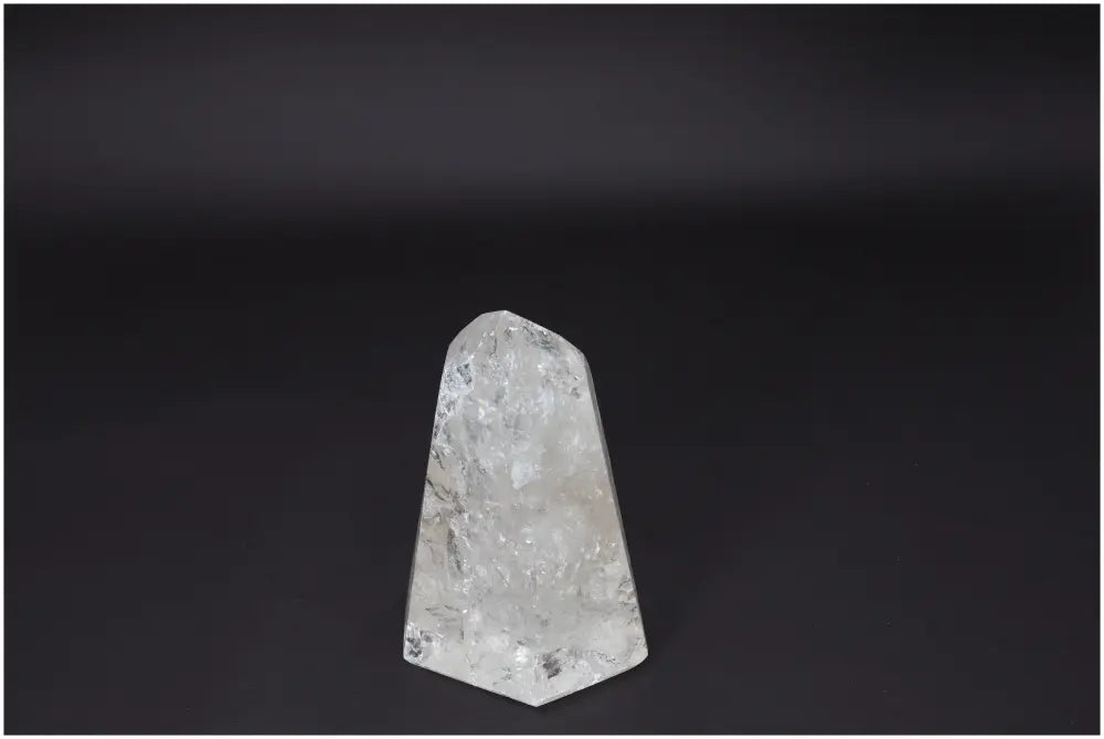 Lemurian Quartz Obelisk displaying clear crystalline structure for clarity, balance, and personal growth on a dark background.