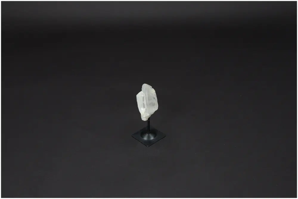 Lemurian Quartz crystal on elegant metal stand, promoting clarity and balance, ideal for personal growth and energy amplification.