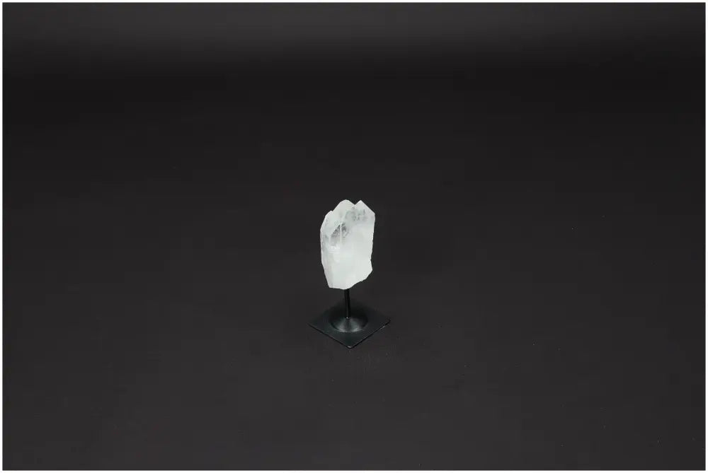Lemurian Quartz crystal on metal stand, perfect for enhancing clarity and balance through amplified intentions and energy.