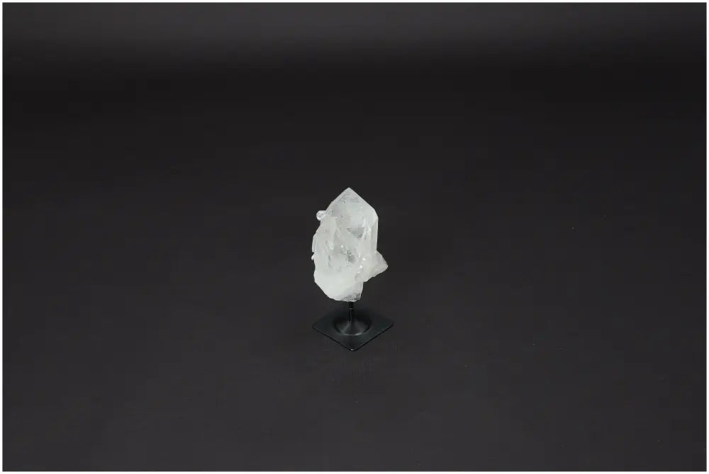 Lemurian Clear Quartz Crystal on metal stand for clarity and balance, hand-selected and ethically sourced for personal growth.