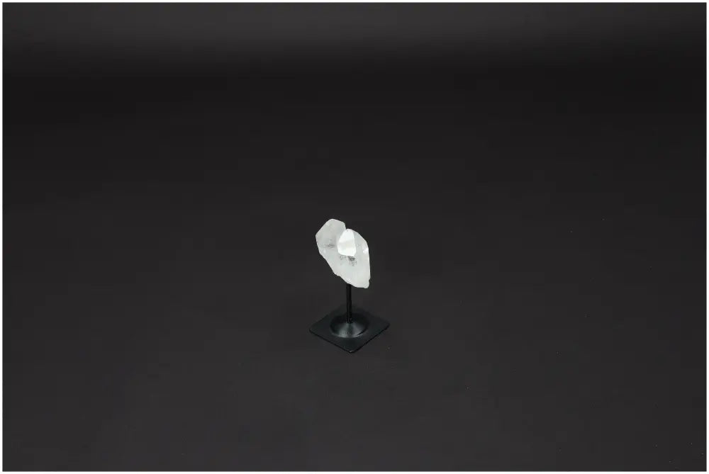 Lemurian Quartz crystal on a sleek metal stand, emphasizing clarity, balance, and personal growth as the "Master Healer."