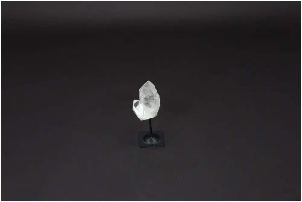 Lemurian Clear Quartz on Metal Stand, a powerful purification stone, neutralizes negative energy and electromagnetic radiation.