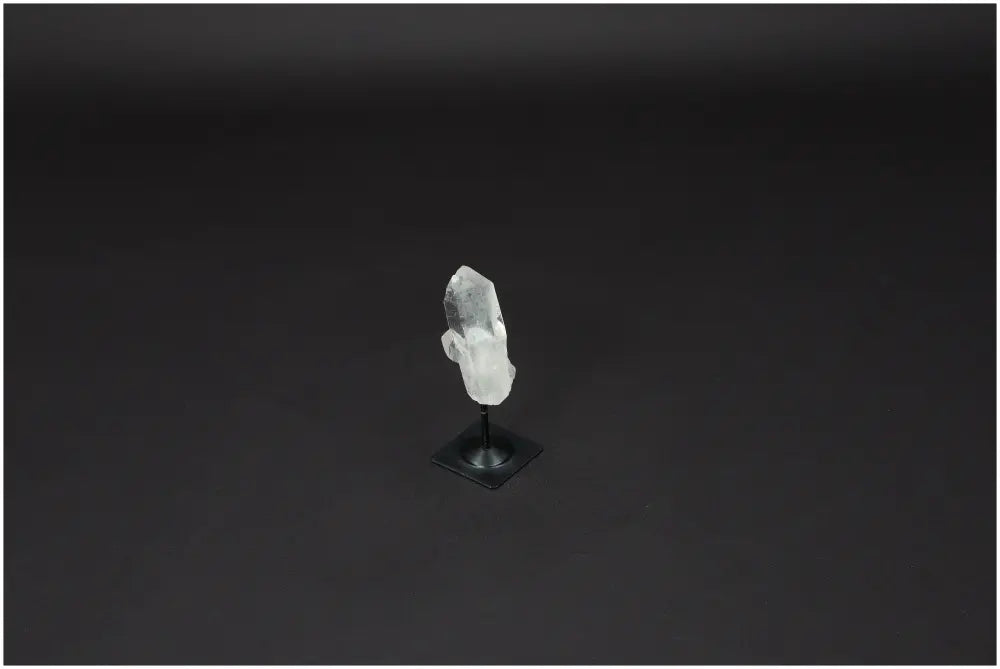 Lemurian Quartz crystal on sleek metal stand, ideal for energy cleansing and harmonization.