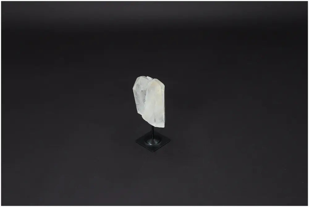 Lemurian Quartz on metal stand, clear crystal for purification, harmonizing energy, and detoxifying spaces from negative vibrations.