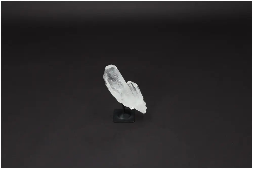 Lemurian Quartz Crystal on metal stand, showcasing its clear natural structure and ideal for harmonizing and purifying space.