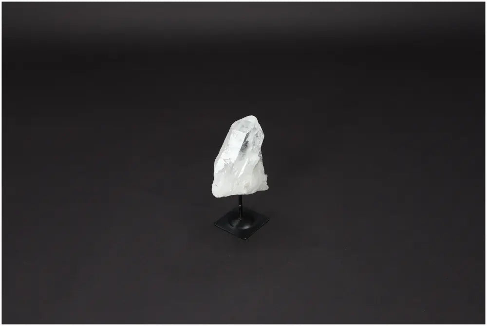 Lemurian Quartz on metal stand, clear crystal for purification and harmonizing energy, ideal for dispelling negativity and cleansing spaces.