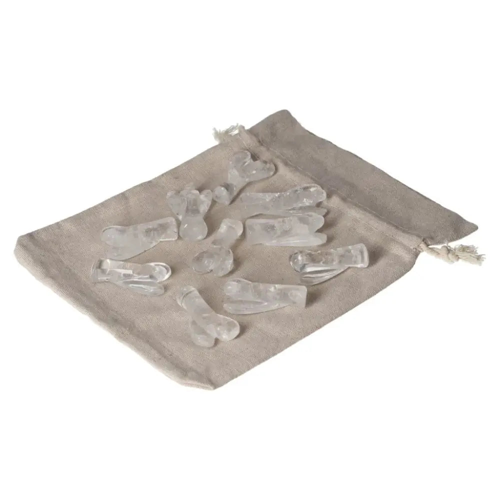 Clear Quartz Lemurian Small Angel stones on linen pouch, ideal for purification and harmonizing energy, mind, and body.