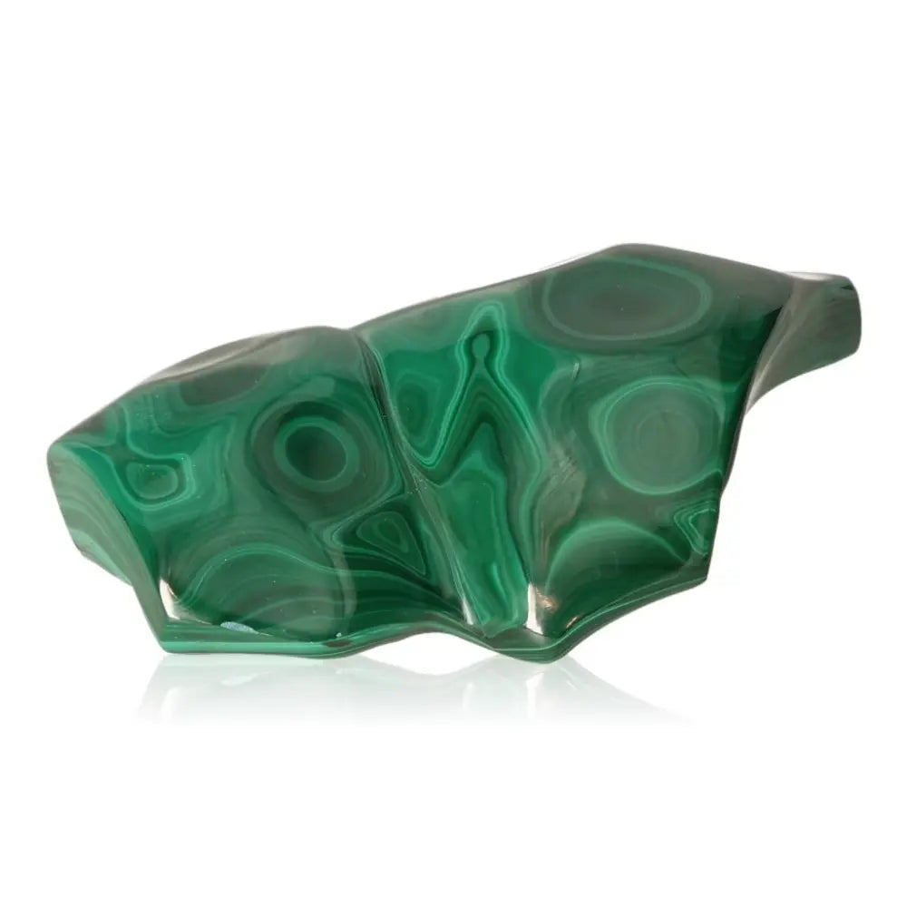 Polished green malachite stone with natural swirls, symbolizing courage and tranquility, on a white background.