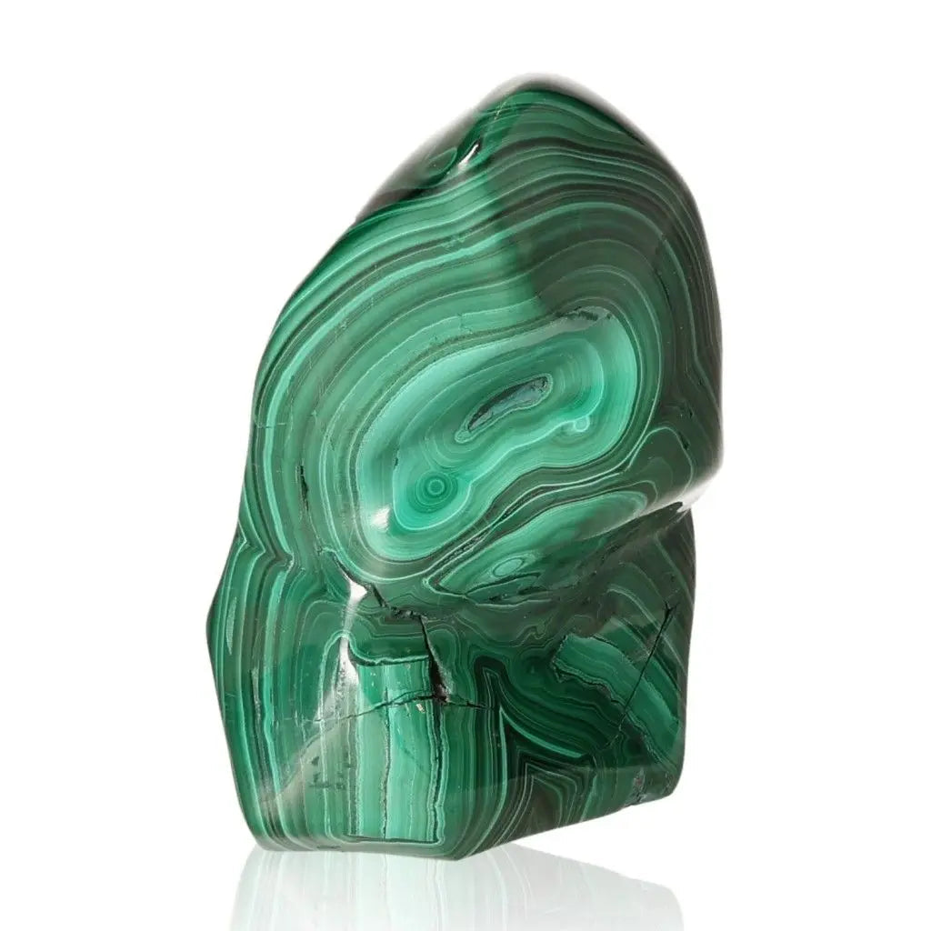 Smooth polished malachite gemstone with vibrant green swirls, embodying nature's essence and possessing energizing and calming properties.