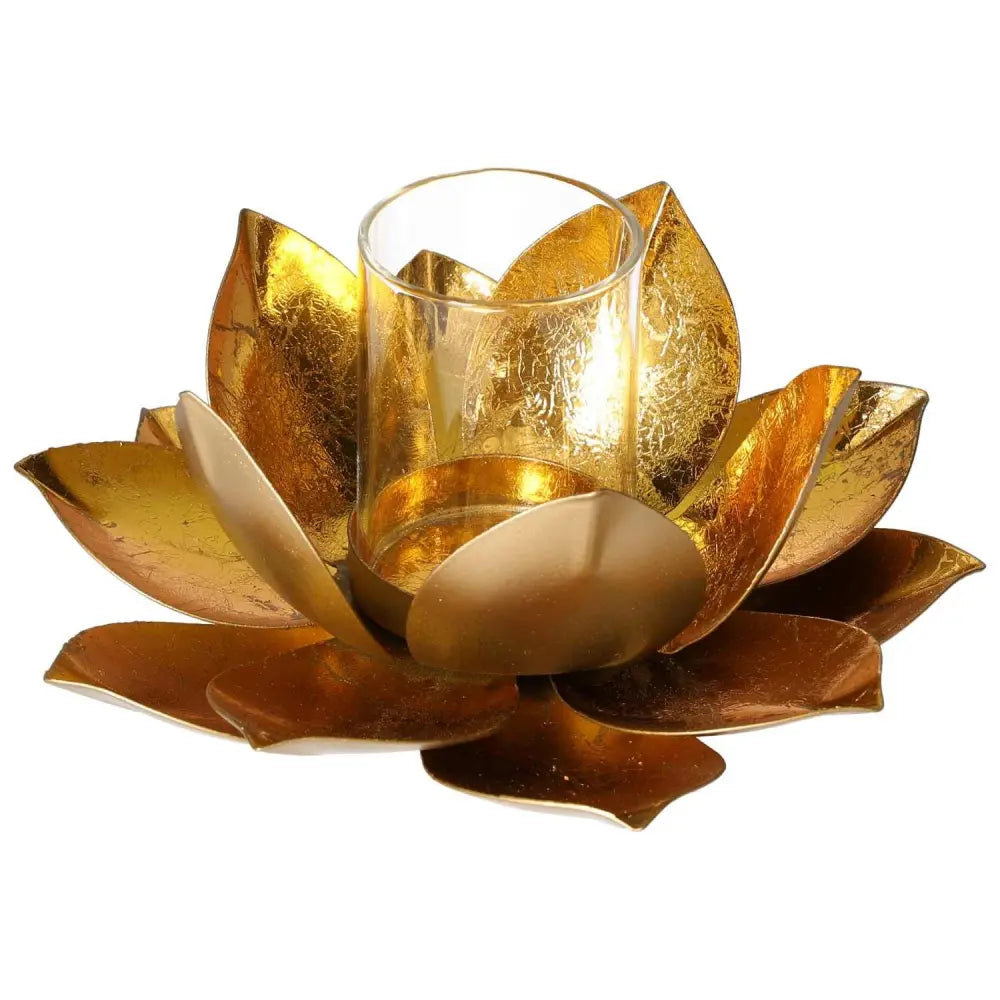 Golden metal lotus candle holder with glass center, elegant home decor piece by Sylvia Crystals, inspired by blooming lotus design.