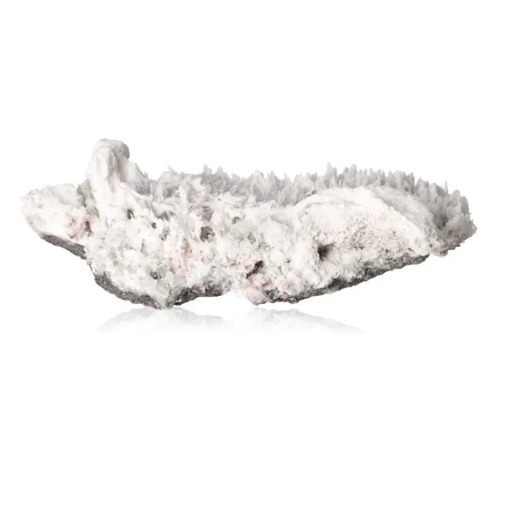 Museum Quality Milky Quartz gemstone showcasing mystical energy and timeless elegance on a reflective surface.