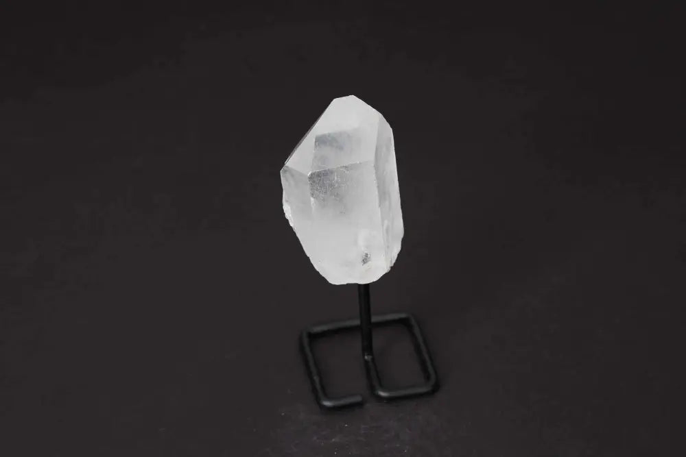 Natural Clear Quartz Point on Stand, perfect for amplifying energy and enhancing clarity, ideal for meditation and manifestation.