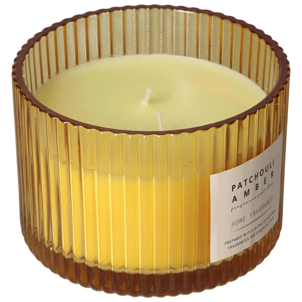 Patchouli Amber scented candle in ribbed glass jar, luxury home fragrance.
