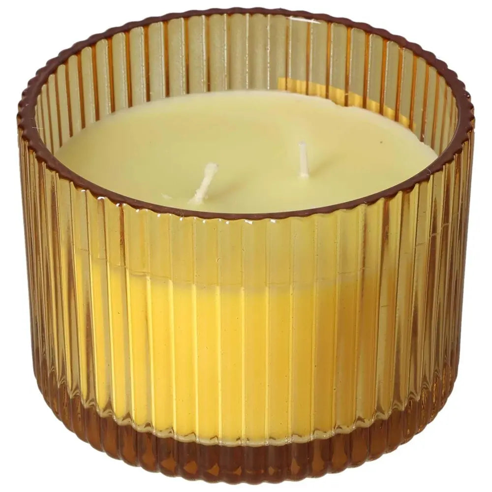 Patchouli Amber scented candle in a ribbed glass jar, crafted from natural soy wax for an eco-friendly burn, aligning with sustainable living.